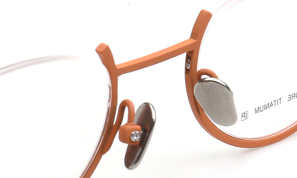 nose pads of orange titanium eyewear