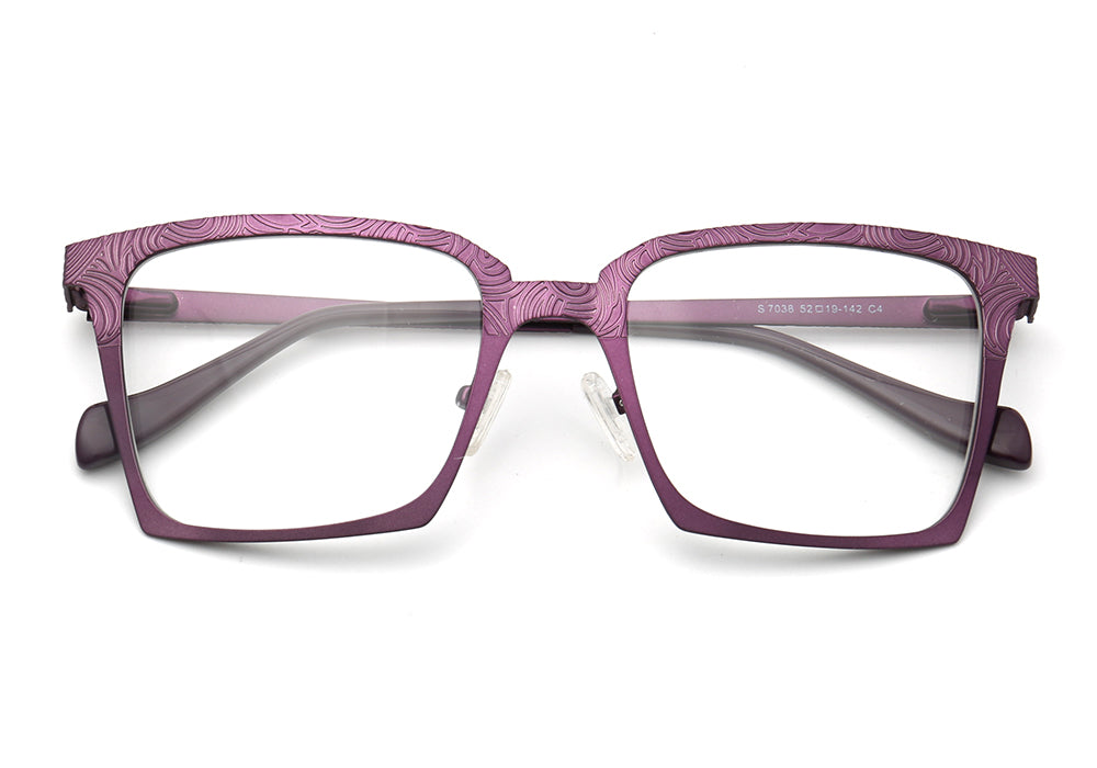 A pair of purple patterned stainless steel eyeglass frames