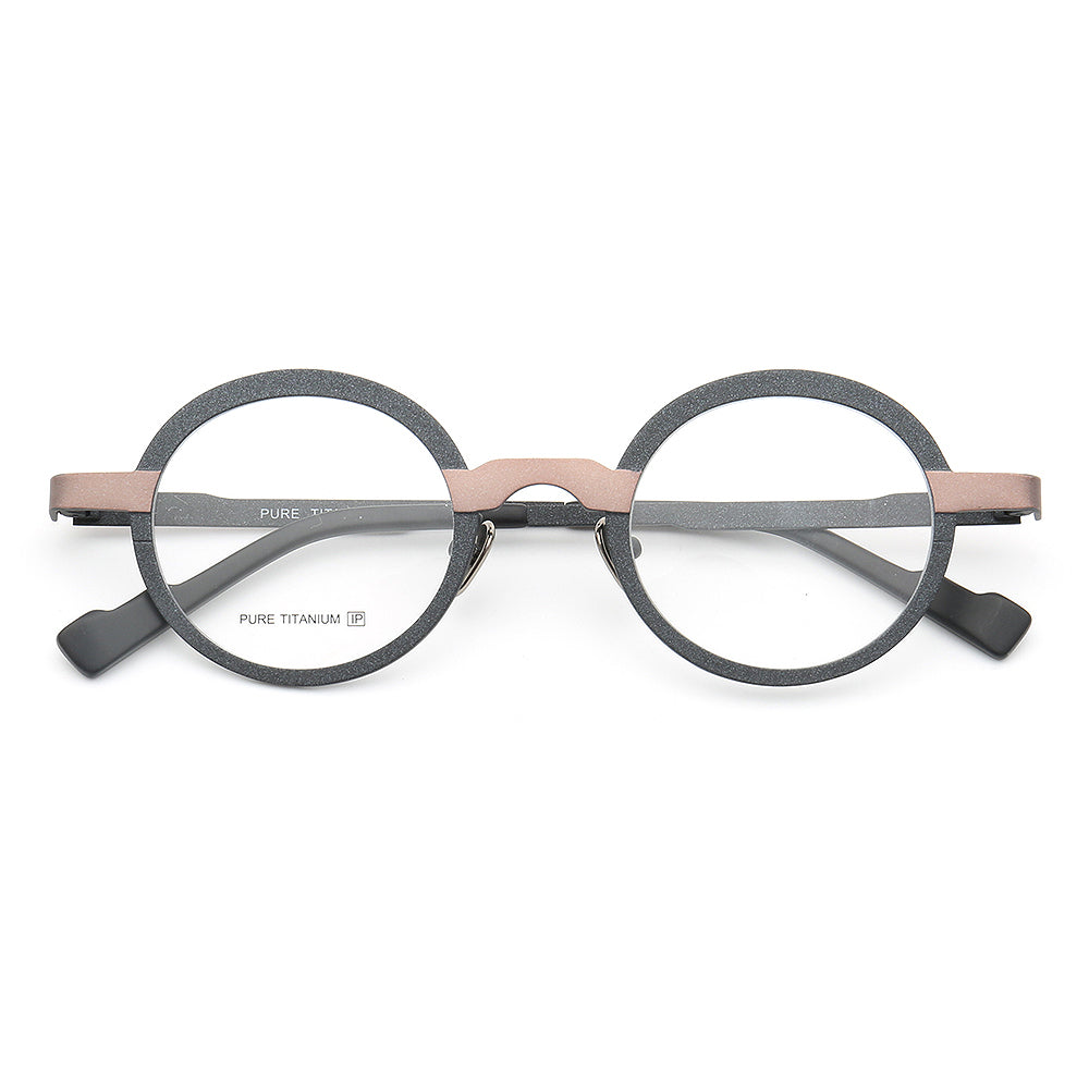 A pair of black and bronze round titanium glasses