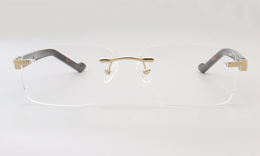 A pair of gold rimless rectangular eyeglasses for men