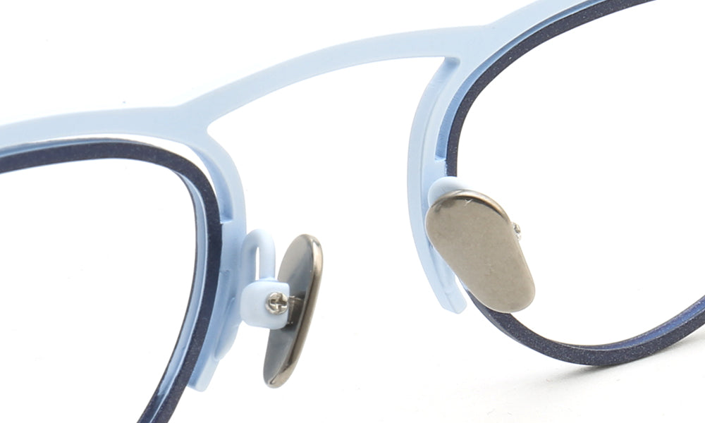 Nose pads of blue titanium eyeglass frames