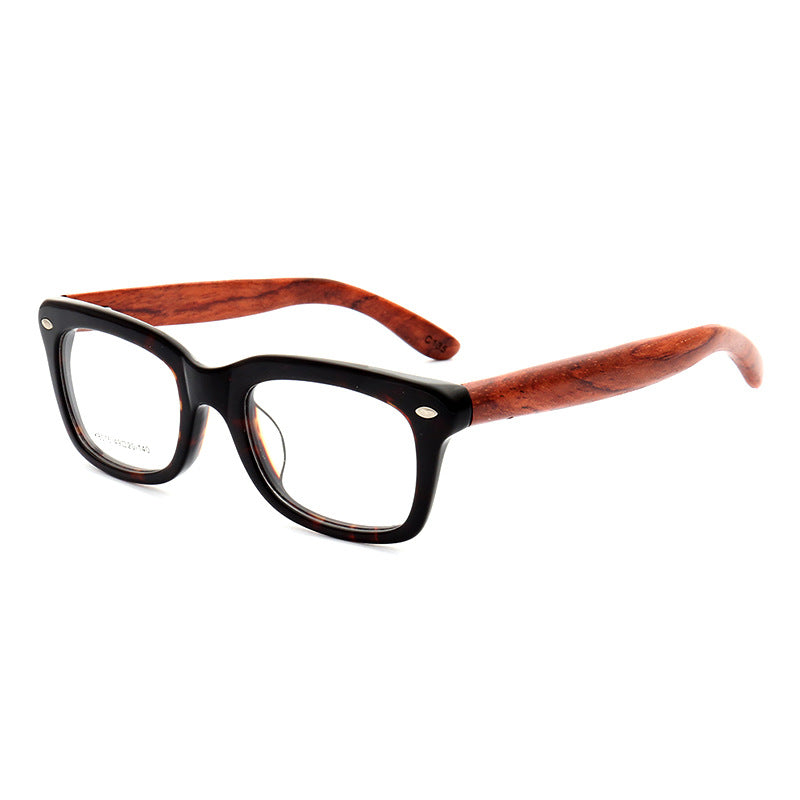 A pair of full rim tortoise patterned wooden glasses frames