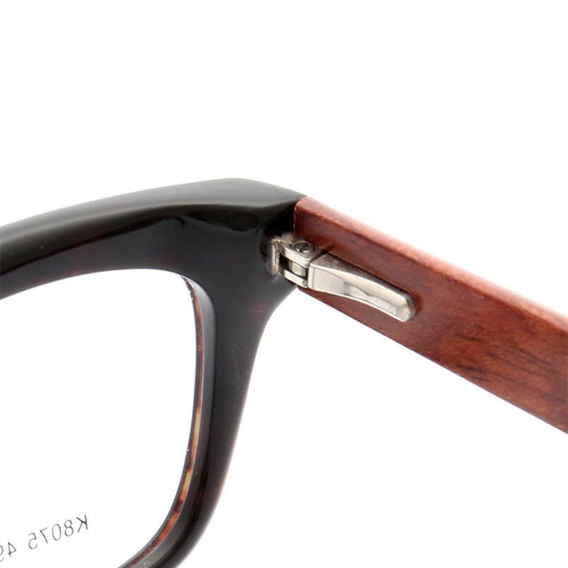 Inner hinge of tortoise patterned wooden eyeglass frames