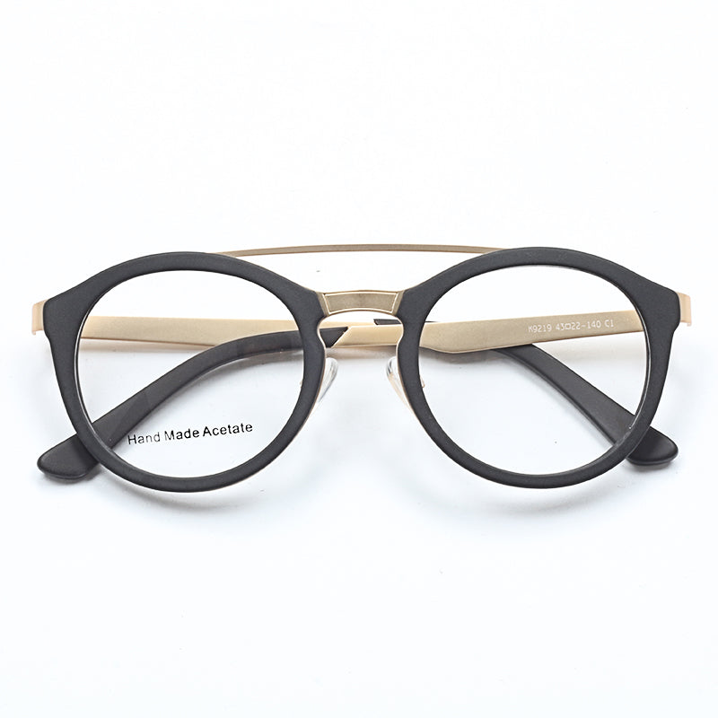 A pair of round black acetate glasses frames