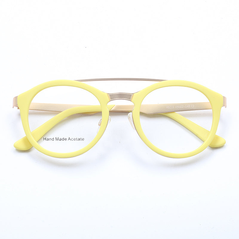 A pair of yellow flat top acetate glasses frames