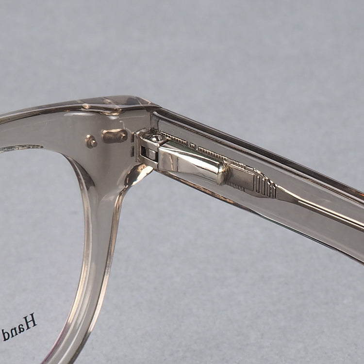 Inner hinge of clear round acetate eyeglass frames