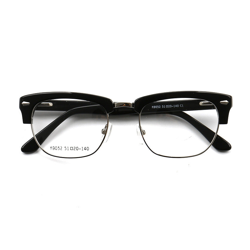 A pair of black half rim retro eyeglass frames