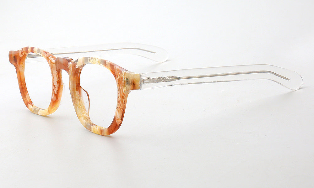 Side view of clear orange patterned tortoise eyeglasses