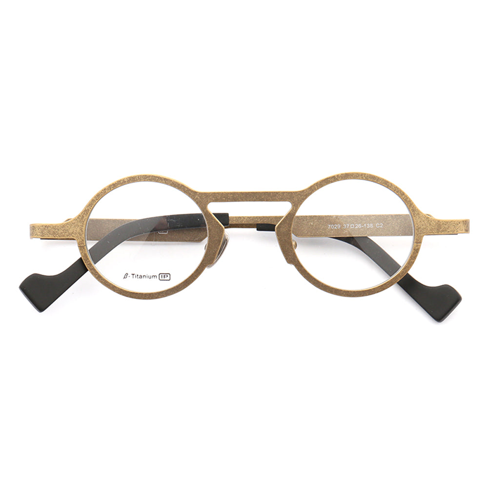 A pair of retro gold titanium eyeglasses