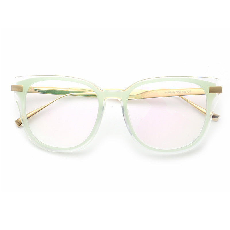 A pair of light green full rim titanium eyeglasses