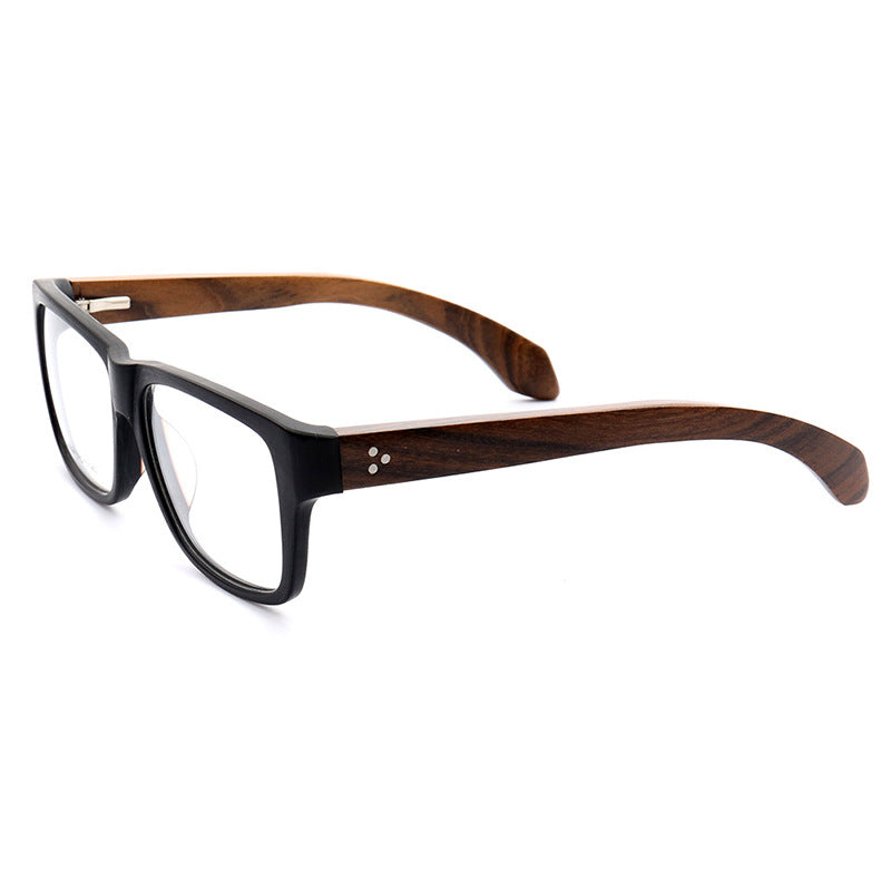 A side view of black and brown wood glasses frames