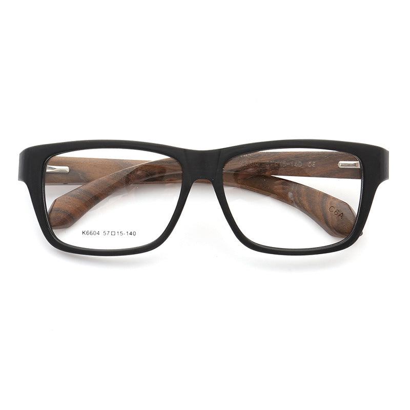 A pair of black and brown wood glasses frames