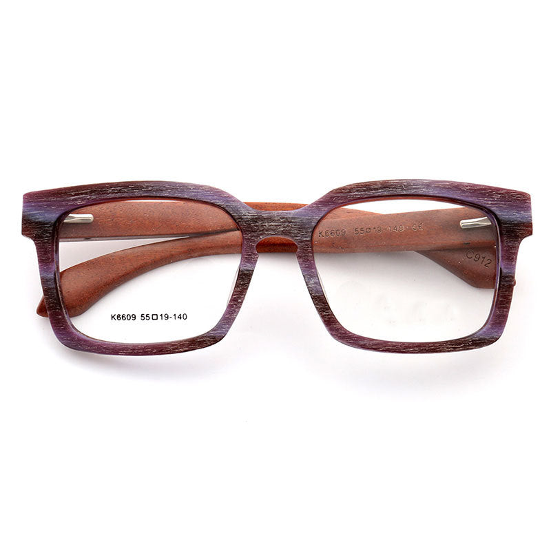 A pair of multicolored oversized wooden eyeglasses