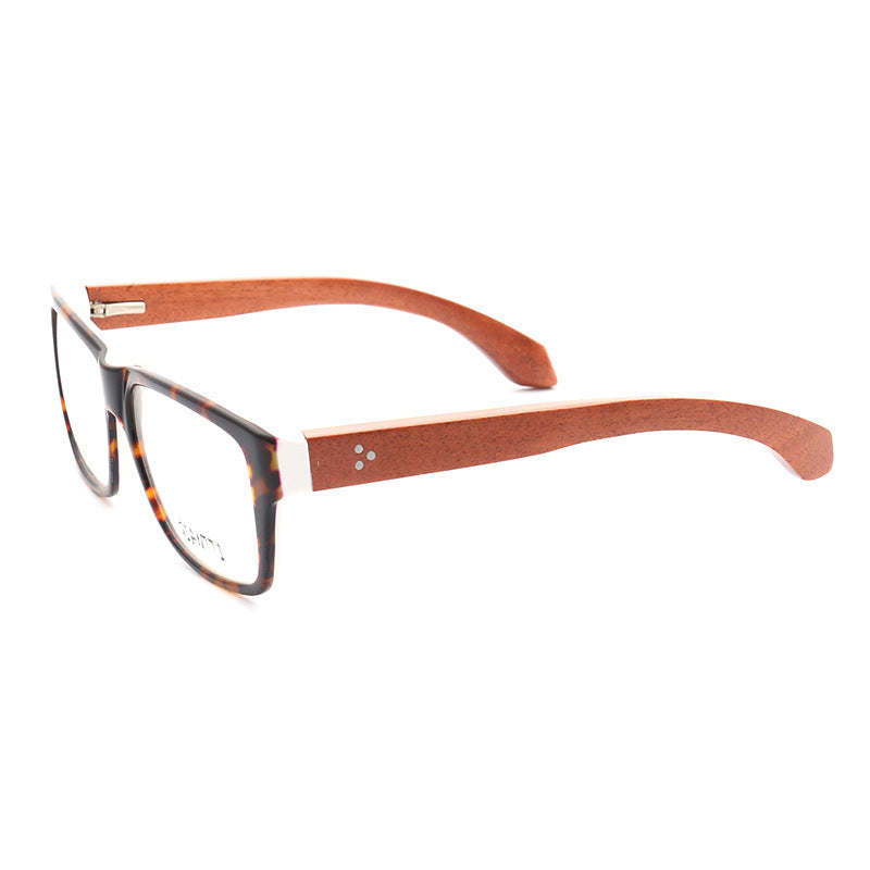 A pair of wooden eyeglasses with tortoise shell pattern