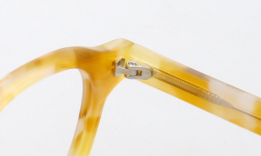 Inner hinge of yellow full rim acetate eyeglass frames