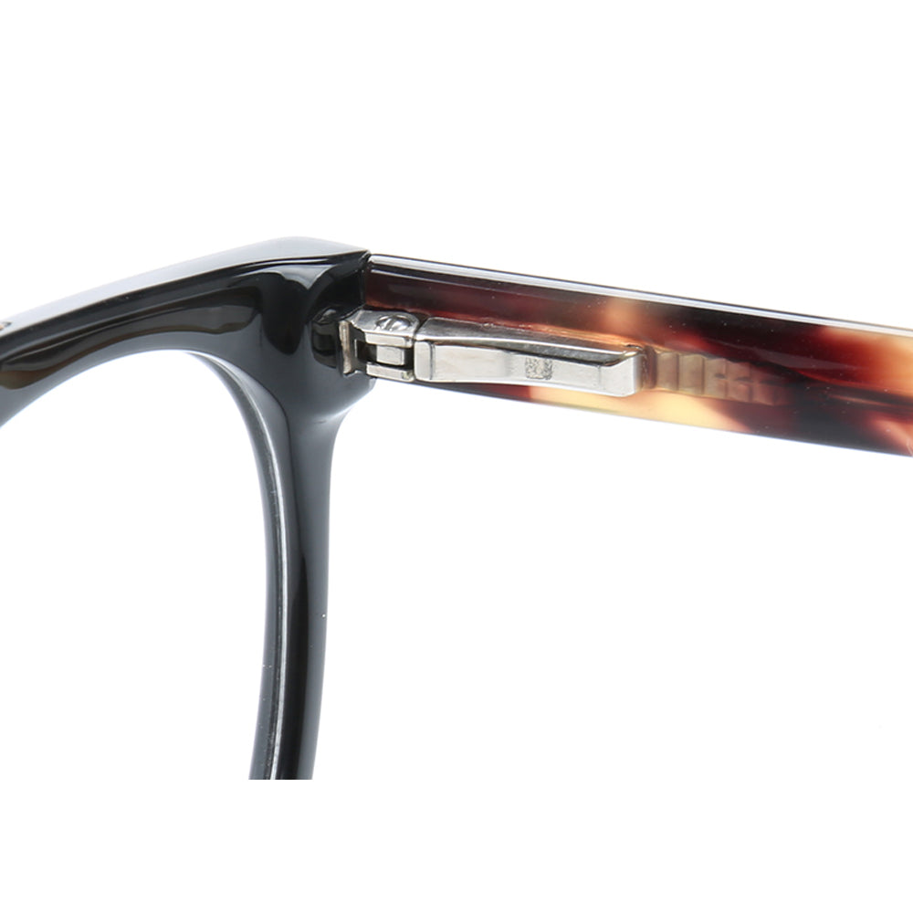 Inner hinge of black tortoise eyeglass frames