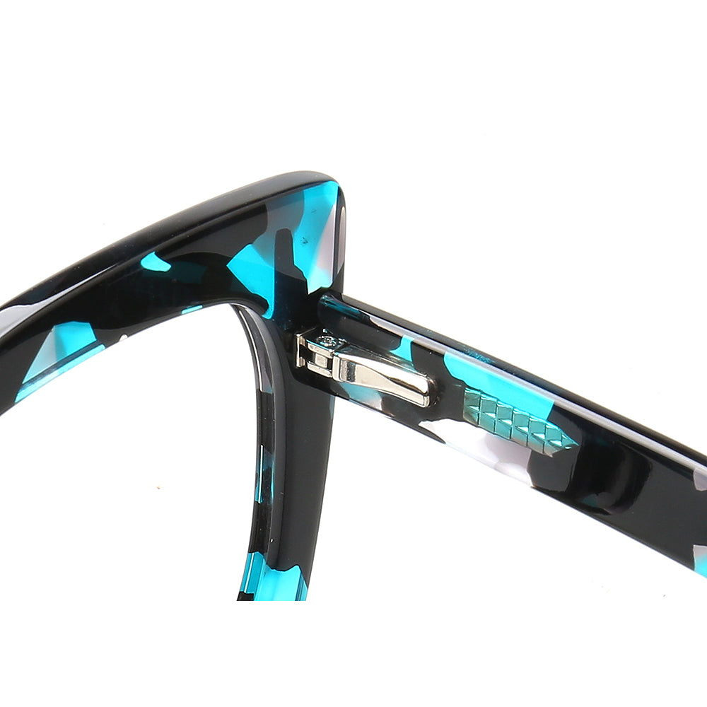 Inner hinge of blue tortoise shell eyeglass frames