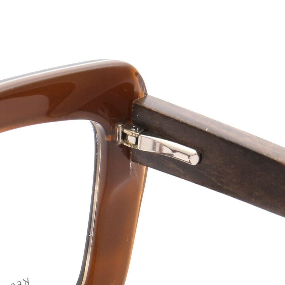 Inner hinge of brown wooden eyeglass frames