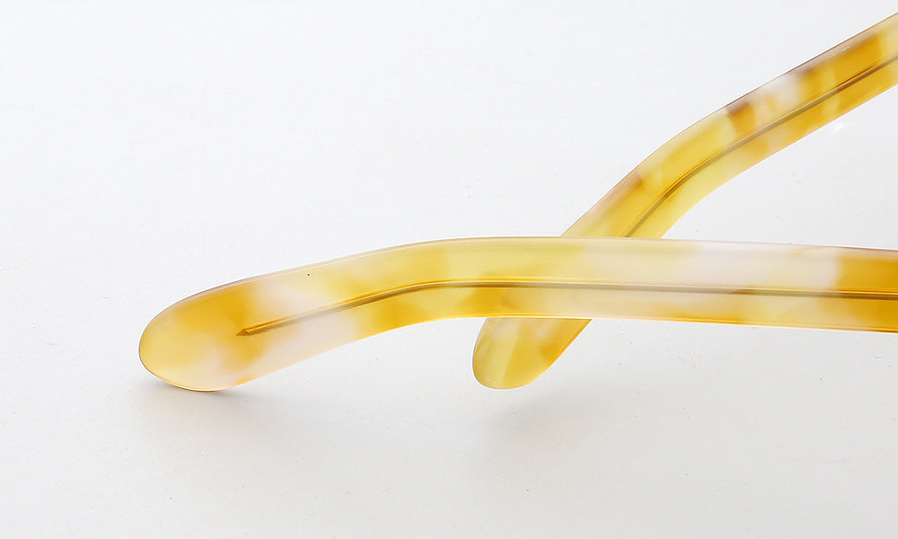 Temple tips of yellow tortoise acetate eyeglasses